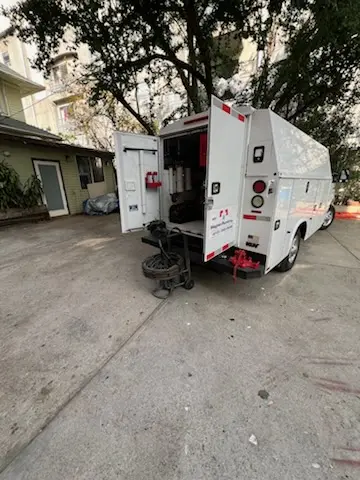 Magnet Plumbing service vehicle on-site for Grease Trap Cleaning in Marlin Forest